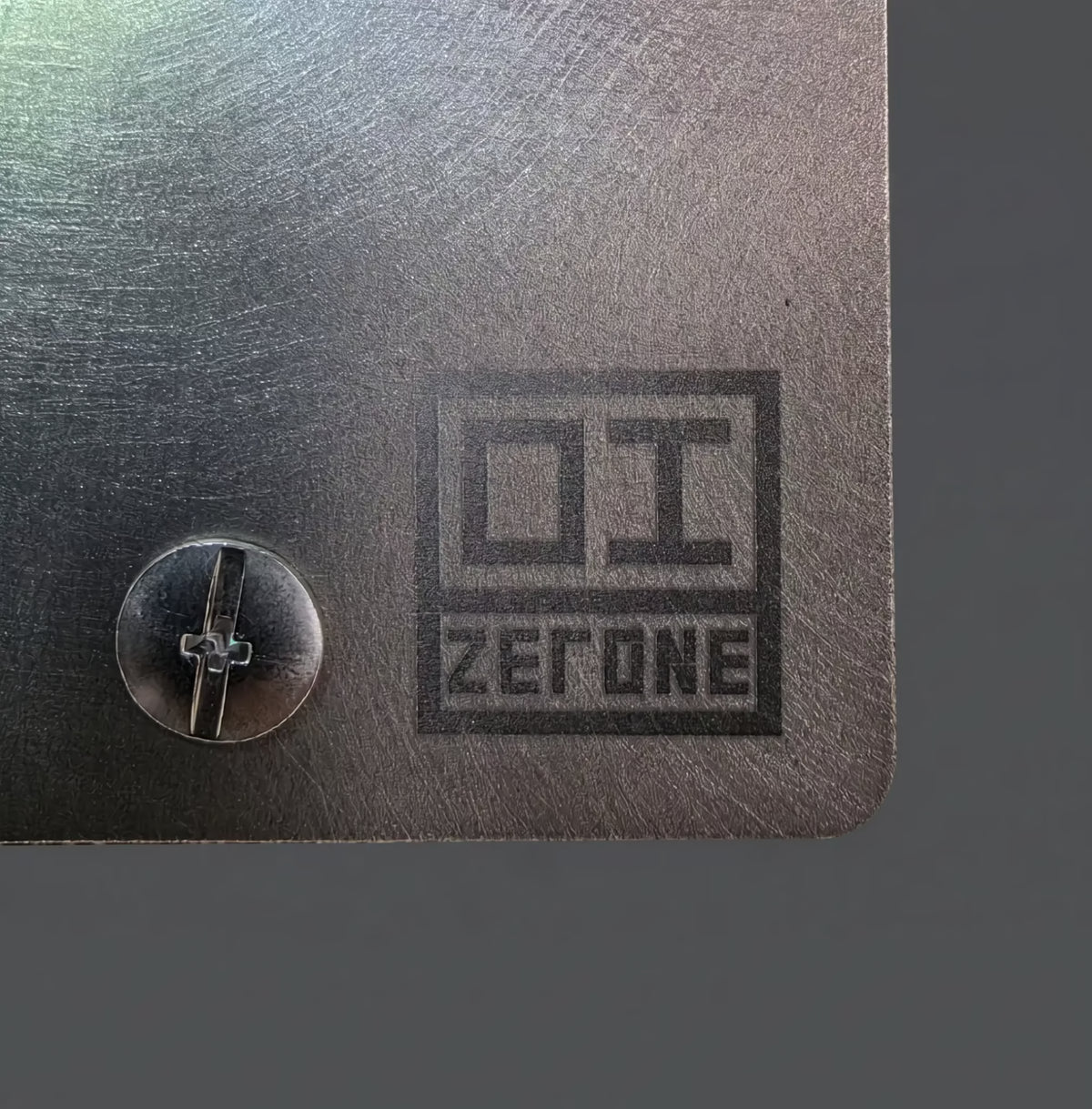ZERONE Brushed plate – engraved logo detail in Grade 2 titanium
