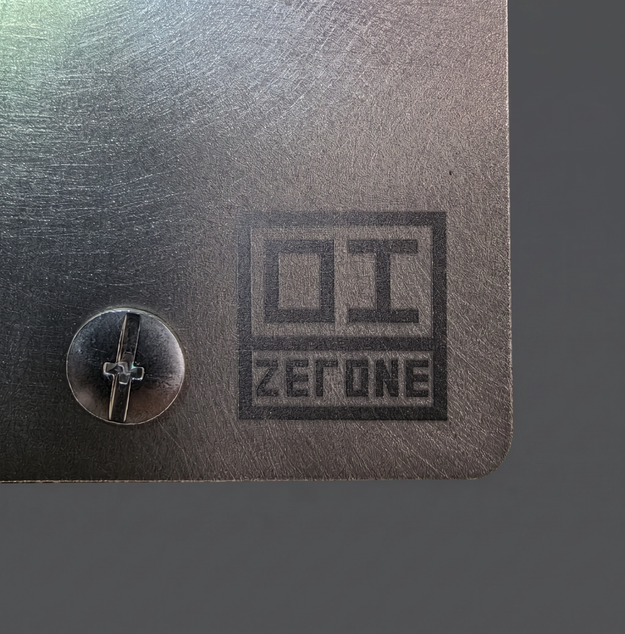 ZERONE Brushed plate – engraved logo detail in Grade 2 titanium