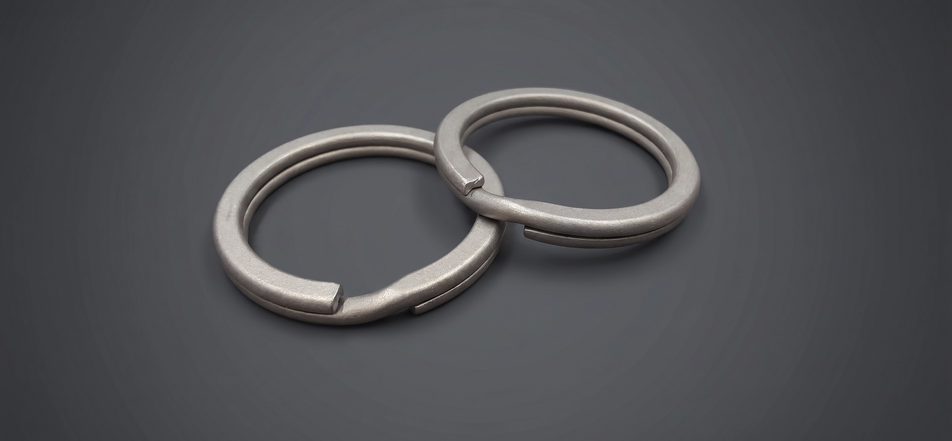 ZERONE titanium keyrings – set of 2 front view